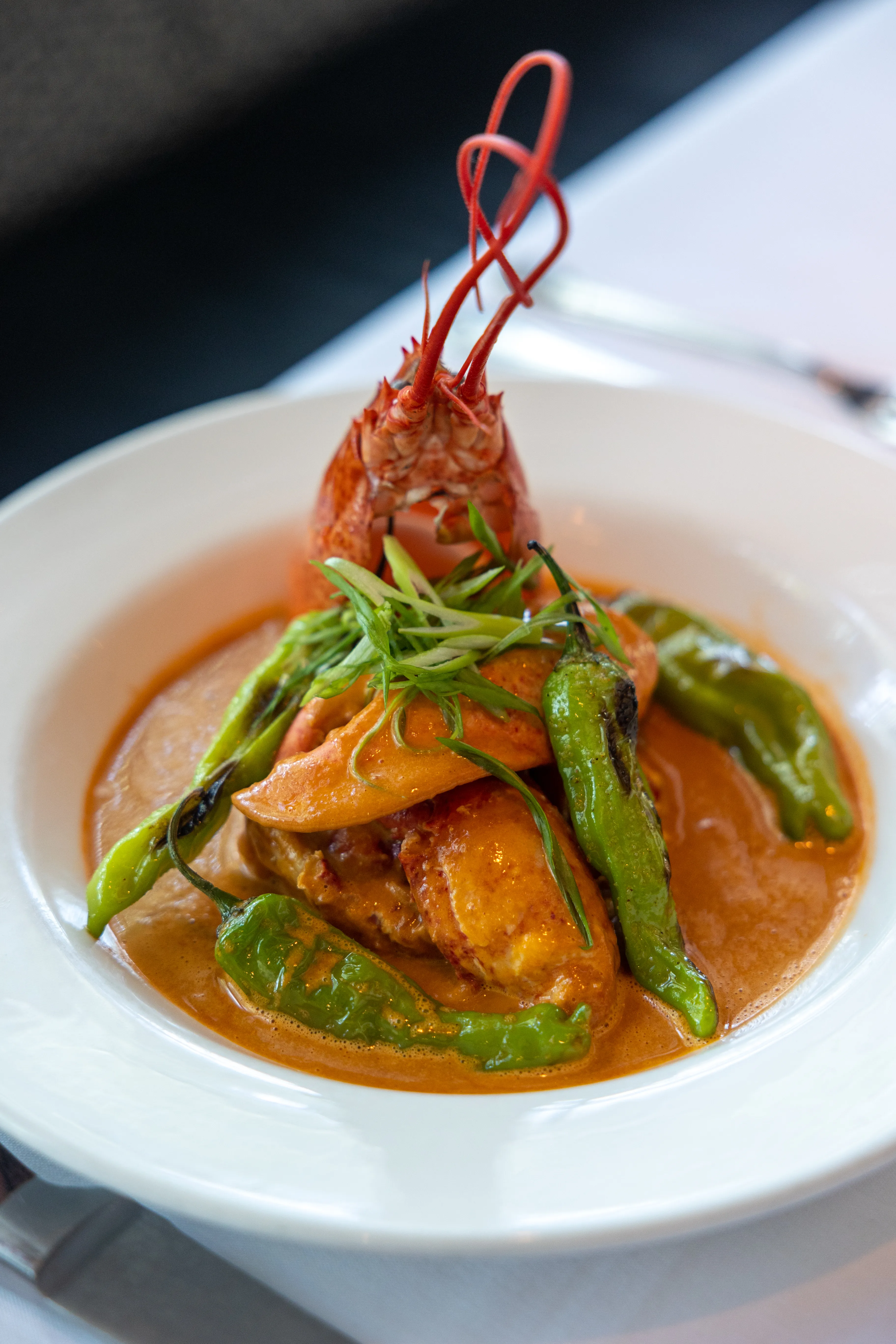 Whole Chili Lobster with shishito peppers at Chops Lobster Bar, Boca Raton