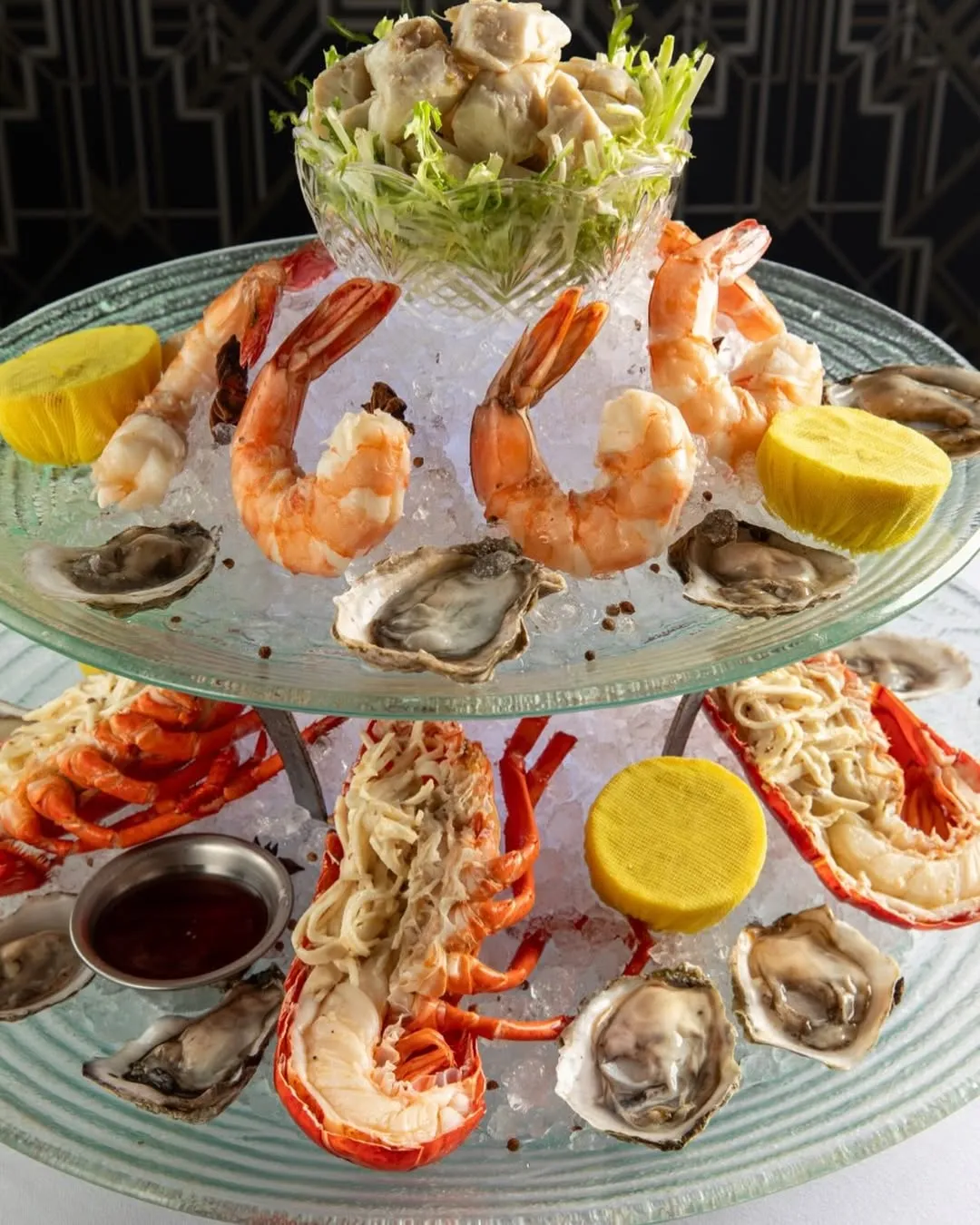 Chops Lobster Bar seafood tower with fresh oysters, shrimp, and lobster