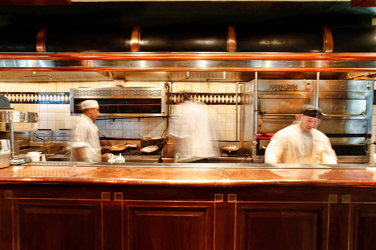 The kitchen at Chops Lobster Bar with busy cooks